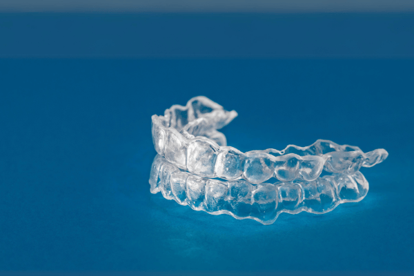Clear aligners on blue background